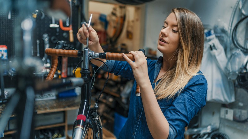 woman fixing bike